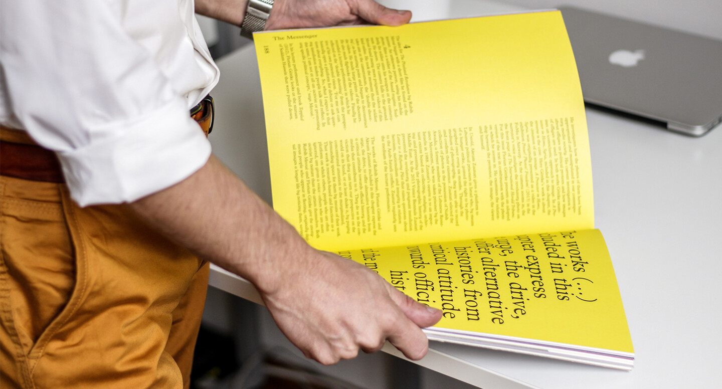 Men looking at typography brochure design