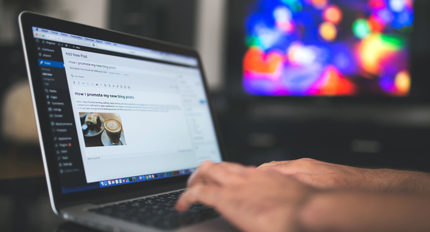 Men updating a website on a content management platform